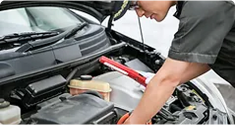 A mechanic performing vehicle inspection